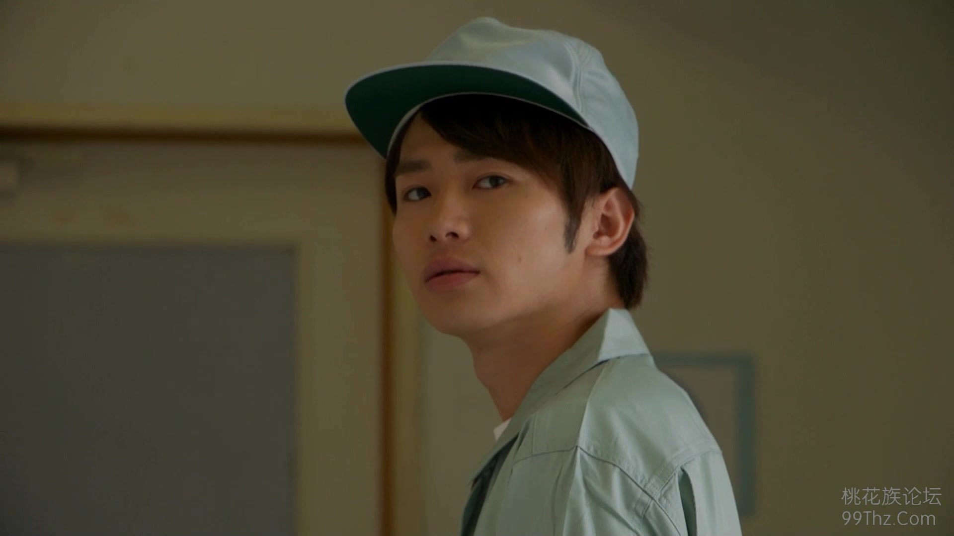 a woman in a dark bra looking over her shoulder